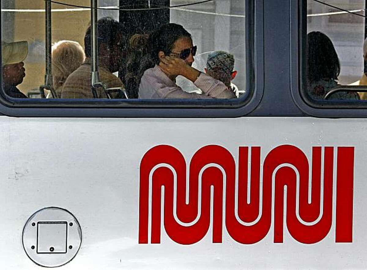 MUNI passengers ride the light rail system on Duboce Street at Church in San Francisco Tuesday August 4, 2009