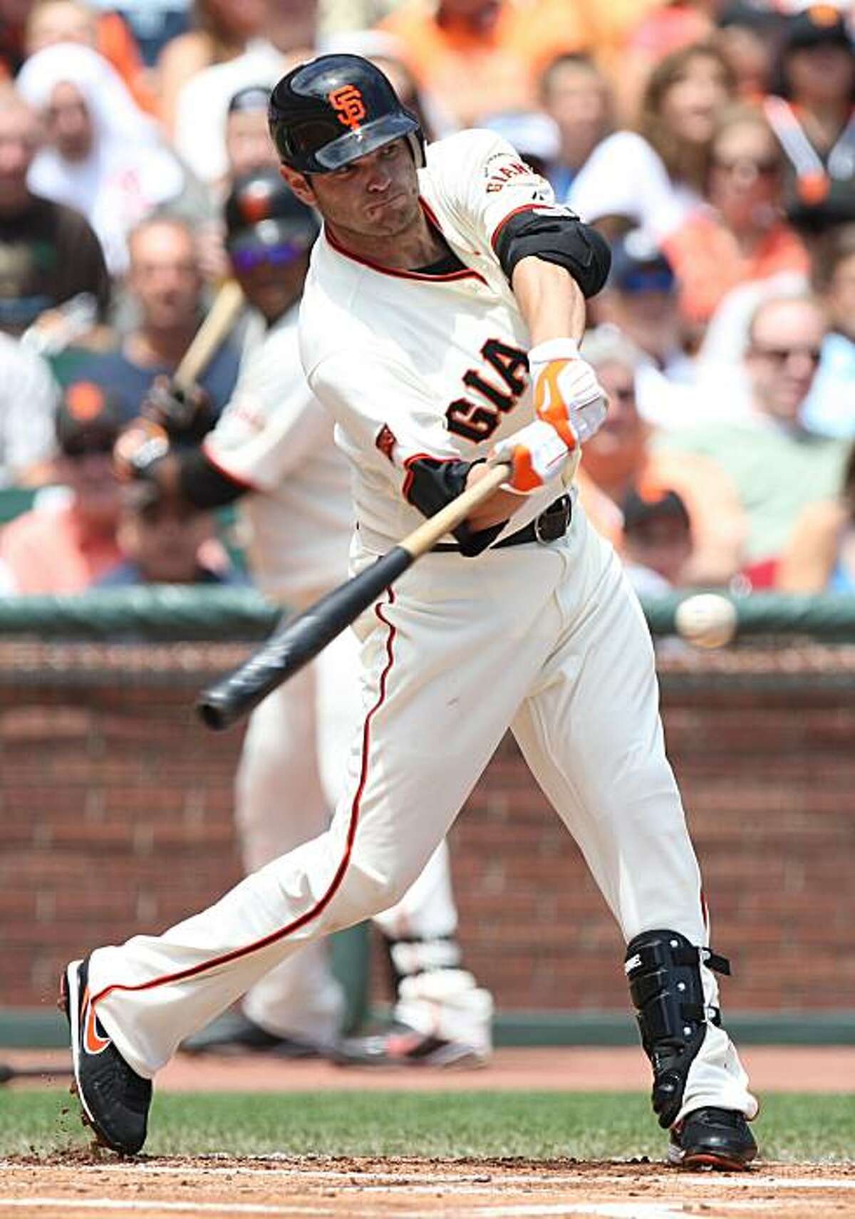 SAN FRANCISCO - AUGUST 02: Freddy Sanchez #21 of the San Francisco Giants singles in the first inning against the Philadelphia Phillies during a Major League Baseball game at AT&T Park on August 2, 2009 in San Francisco, California. (Photo by Jed Jacobsohn/Getty Images)