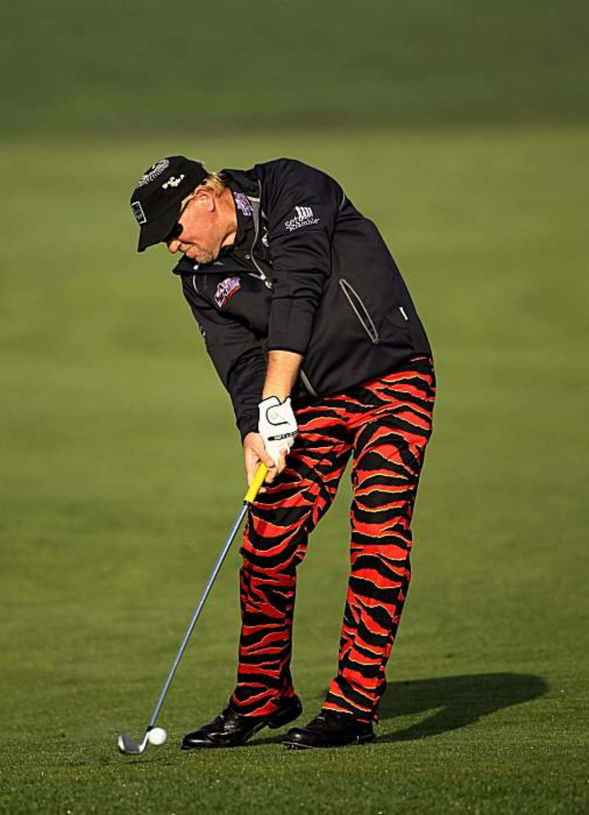 PEBBLE BEACH, CA - FEBRUARY 13: John Daly hits his approach shot on the second hole during round three of the AT&T Pebble Beach National Pro-Am at Pebble Beach Golf Links on February 13, 2010 in Pebble Beach, California.