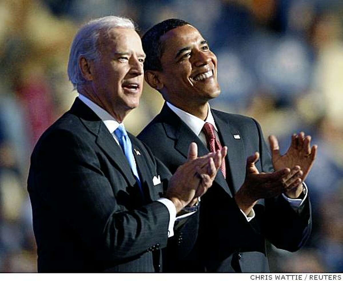 Presidential candidate U.S. Senator Barack Obama (D-IL) (R) and Vice Presidential candidate U.S. Senator Joe Biden (D-DE) applaud on stage at the 2008 Democratic National Convention in Denver, Colorado August 27, 2008. Democrats nominated Senator Barack Obama (D-IL) on Wednesday as their presidential candidate in a historic first for a black American, sending him into battle against Republican John McCain. REUTERS/Chris Wattie (UNITED STATES) US PRESIDENTIAL ELECTION CAMPAIGN 2008 (USA)