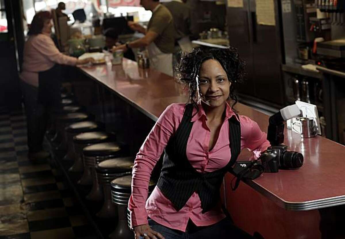 Author/photographer Candacy Taylor sits at the counter at Al's Good Food, Thursday Feb. 4, 2010, in San Francisco, Calif. After working as a waitress Taylor decides to write a book on the dying breed of the career waitresses.