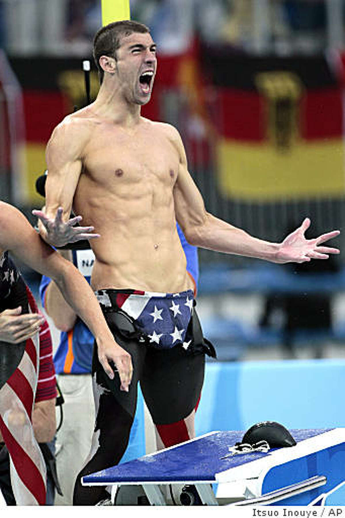 United States' Michael Phelps celebrates as U.S. wins the gold in the men's 4x100-meter freestyle relay during the swimming competitions in the National Aquatics Center at the Beijing 2008 Olympics in Beijing, Monday, Aug. 11, 2008. (AP Photo/Itsuo Inouye)