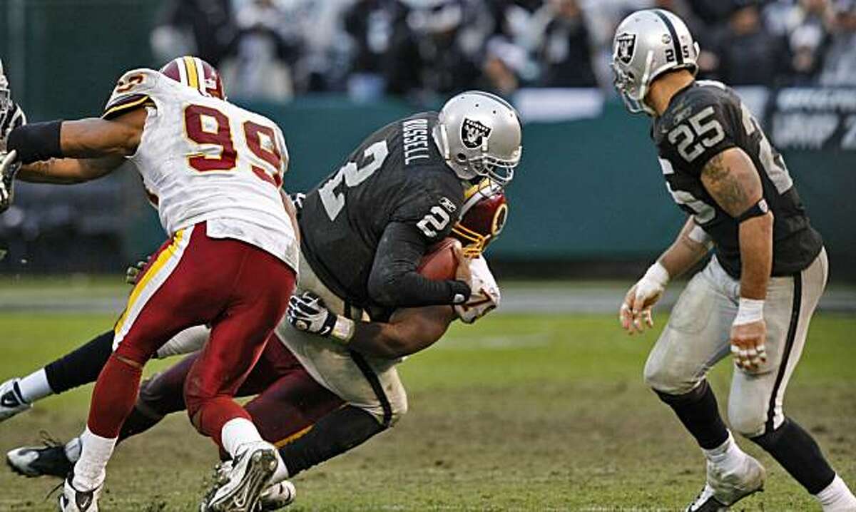 Raiders quarterback JaMarcus Russell is sacked in the second half against the Redskins on Sunday in Oakland.