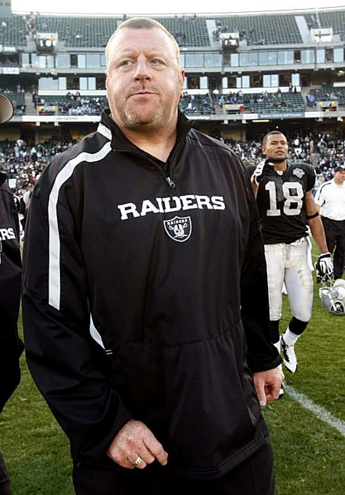 Oakland Raiders head coach Tom Cable walks off the field after an NFL football game against the Baltimore Ravens in Oakland, Calif., Sunday, Jan. 3, 2010. The Ravens won 21-13. (AP Photo/Paul Sakuma)