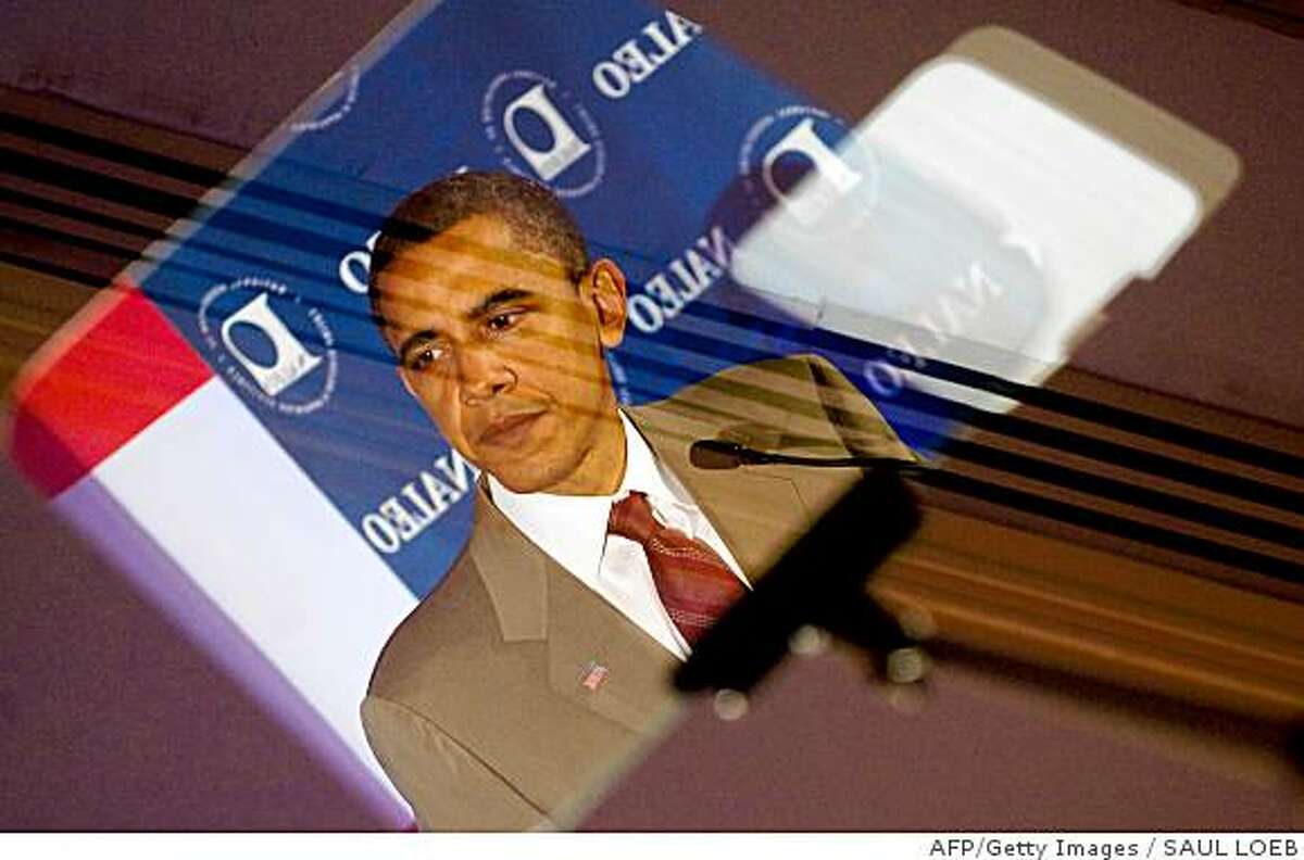Sen. Barack Obama is reflected in his teleprompter as he speaks at the National Association of Latino Elected and Appointed Officials conference on June 28, 2008. AFP-Getty Images / Saul Loeb