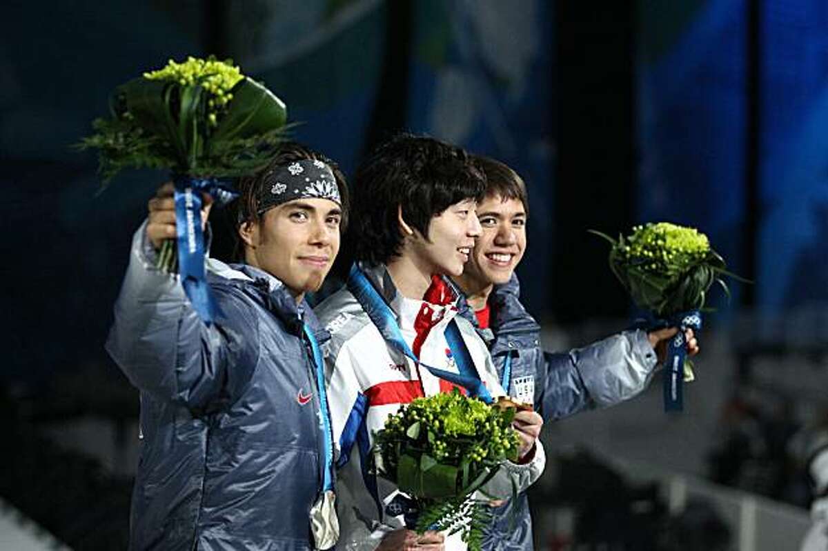 From left, USA silver medalist Apolo Ohno, Korean gold medalist Ho-Suk Lee and USA bronze medalist J.R. Celski stand on the podium during the medal ceremony for the men's 1,500m short-track speed-skating event at the Winter Olympics in Vancouver, Canada, on Sunday, February 14, 2010. (John Lok/Seattle Times/MCT)