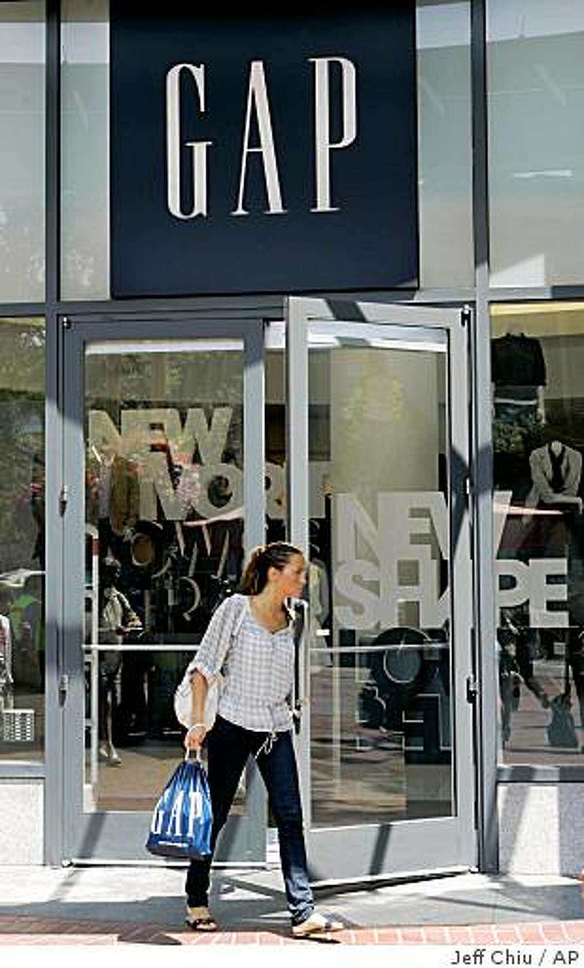 A woman leaves a Gap store in San Francisco, Friday, Aug. 15, 2008. Apparel maker Gap Inc. reports earnings for its fiscal second quarter after the market close Thursday, Aug. 21, 2008. (AP Photo/Jeff Chiu)