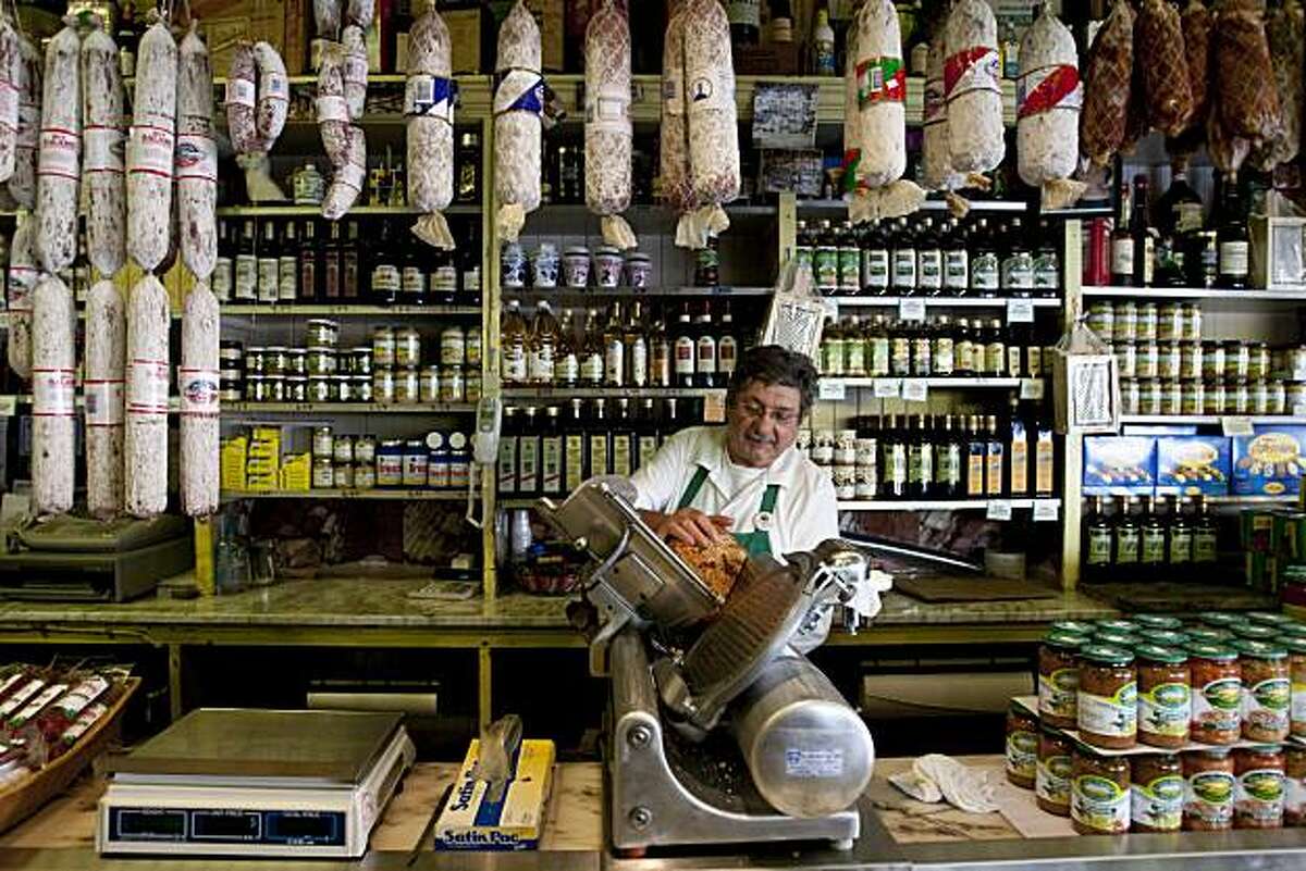 Franco Crivello works the slicer at Molinari Delicatessen on Columbus Ave. in San Francisco, Calif., on Thursday, February 11, 2010.