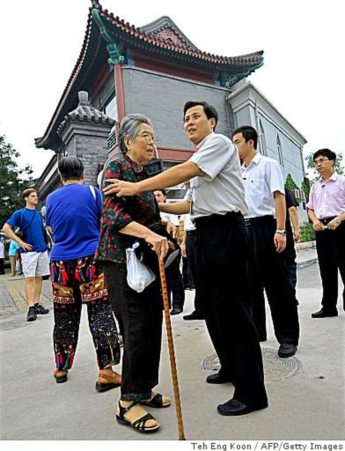 A security official stops a Chinese Christian from attending Sunday service at Beijing Kuanjie Protestant Christian Church in Beijing on August 10, 2008, where US President George W. Bush is attending a service. Bush, who has been in China since August 7 on a visit to the 2008 Beijing Olympic Games, attended a service at the Protestant church in Beijing, reinforcing his call for freedom of religion ahead of a meeting with his Chinese counterpart Hu Jintao. AFP PHOTO/TEH Eng Koon (Photo credit should read TEH ENG KOON/AFP/Getty Images)