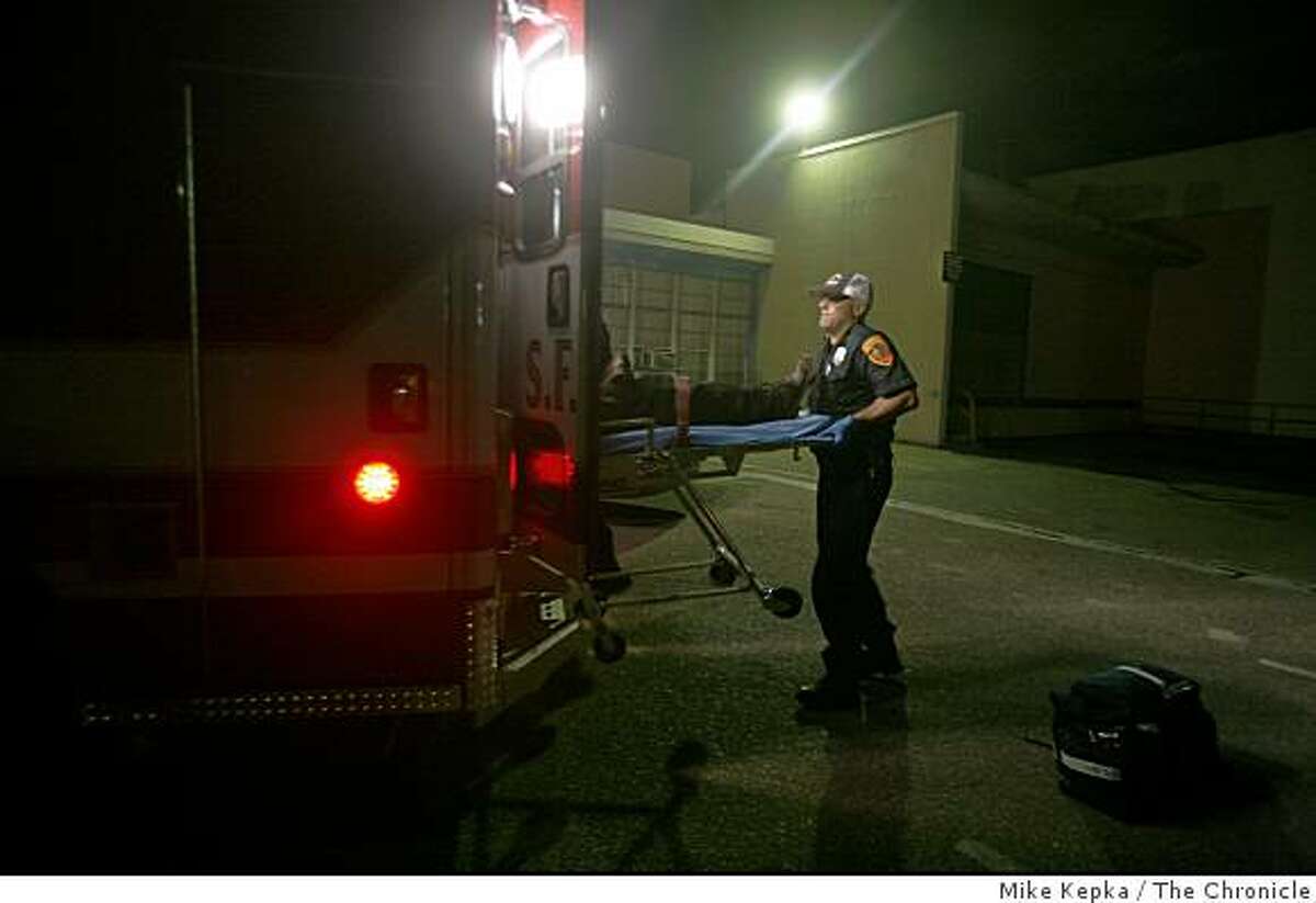 In this file photo, a dynamically deployed emergency responder with the San Francisco Fire Department lifts a patient into the back of an ambulance in San Francisco.