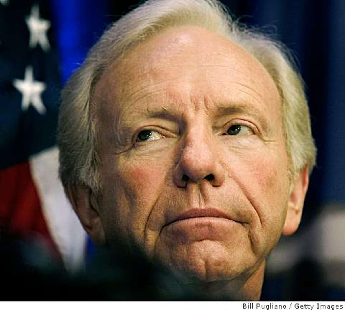 BIRMINGHAM, MI- AUGUST 13: Sen. Joseph Lieberman (I-CT) listens as presumptive republican presidential nominee, U.S. Senator John McCain (R-AZ) speaks with the news media at a press conference August 13, 2008 in Birmingham, Michigan. McCain was in Michigan for fund-raising and campaign events. (Photo by Bill Pugliano/Getty Images)