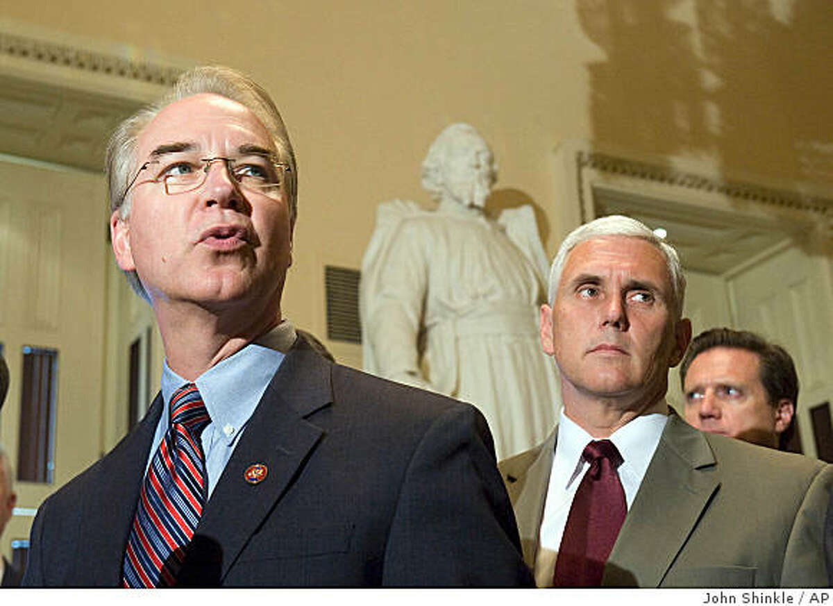 Rep. Tom Price, R-Ga., left, accompanied by Rep. Mike Pence, R-Ind., and others, makes remarks during a news conference on Capitol Hill in Washington, Monday, Aug. 4, 2008, demanding that House Speaker Nancy Pelosi bring back Congress and has a vote on energy legislation during the summer recess. (AP Photo/Politico.com. John Shinkle)