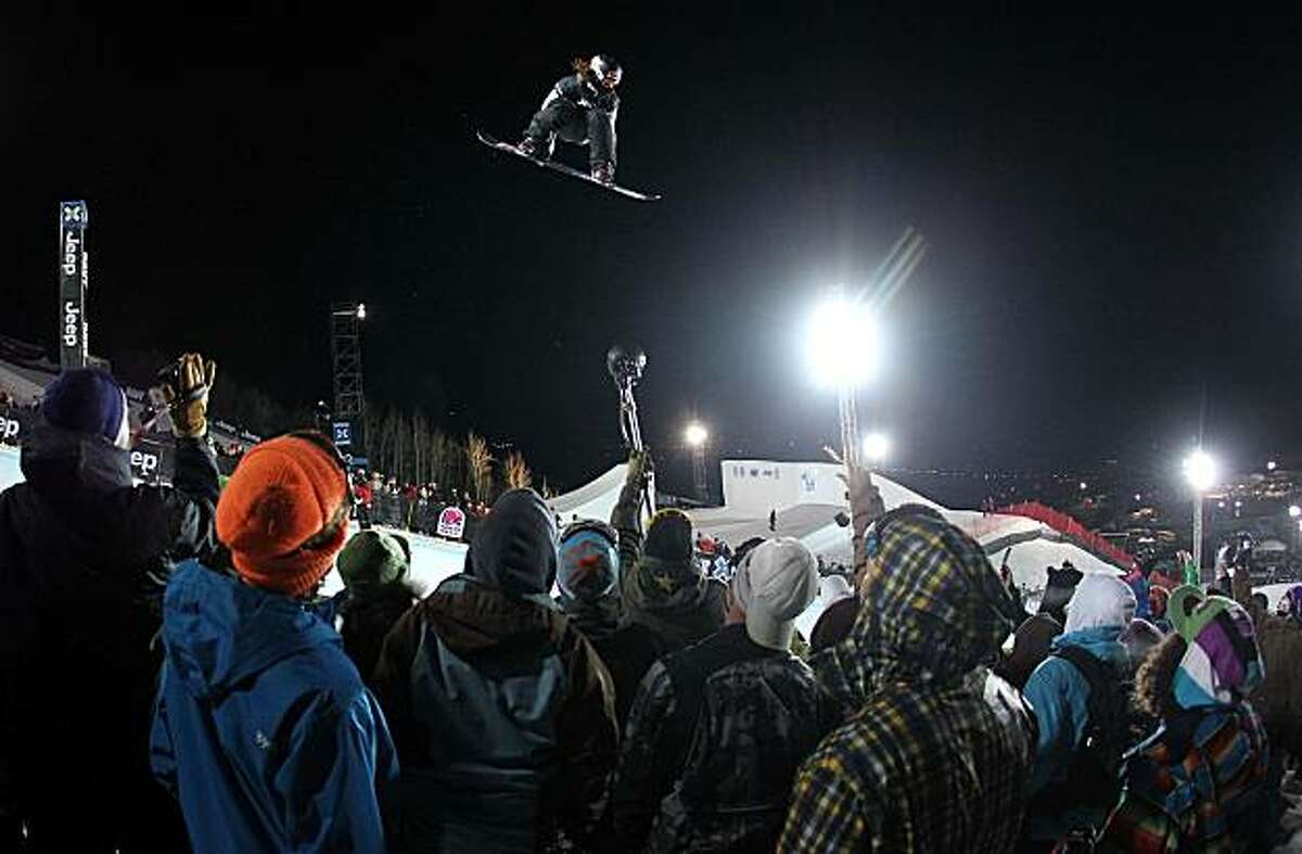 ASPEN, CO - JANUARY 29: Shaun White soars out of the halfpipe and above the crowd enroute to winning the gold medal in the Men's Snowboard Superpipe at Winter X Games 14 at Buttermilk Mountain on January 29, 2010 in Aspen, Colorado.