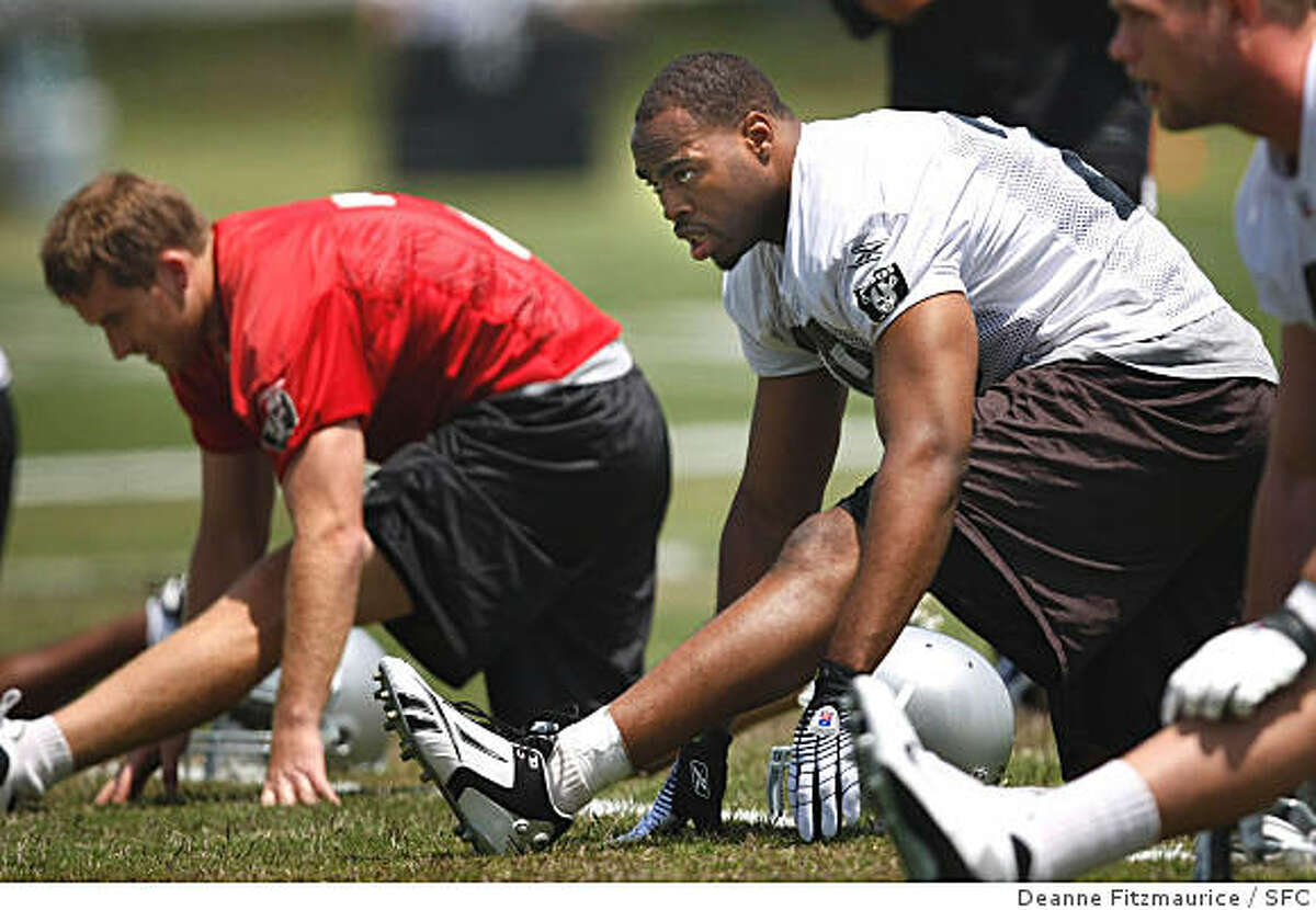 Michael Bush, center, stretches during the Oakland Raiders rookie minicamp at their headquarters in Alameda, Calif. on May 9, 2008. Photo by Deanne Fitzmaurice / San Francisco Chronicle