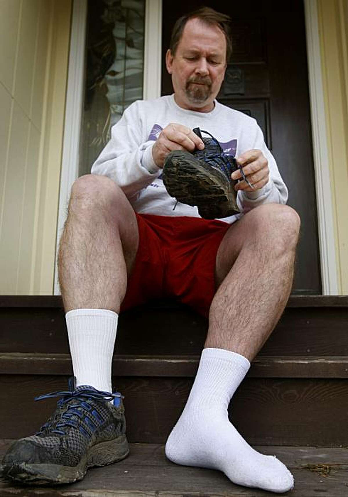 Paul Williams, a scientist at the Lawrence Berkeley National Laboratory, prepares for a morning run at his home in Moraga, Calif., on Friday, Jan. 15, 2010. Williams has spent the past 20 years studying the science of running, using over 100,000 runners participating in his research.