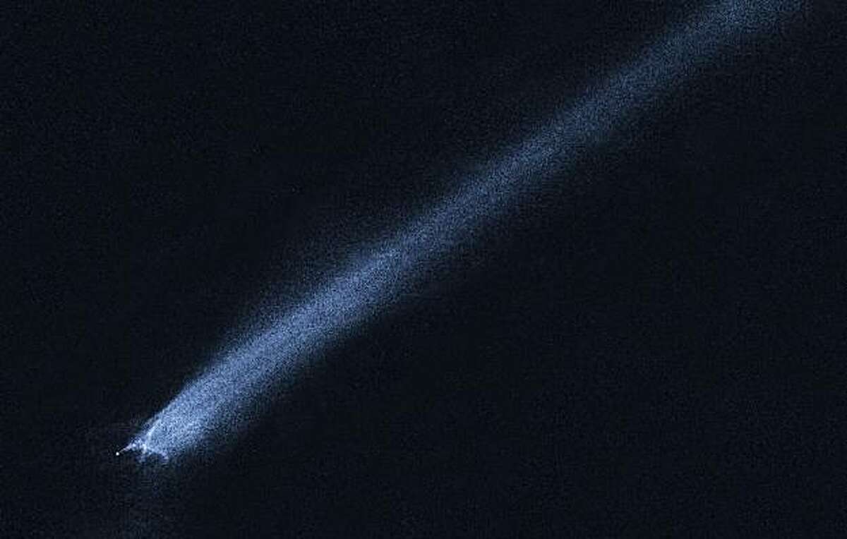 This image provided by NASA Tuesday Feb. 2, 2010 shows a mystery object that was discovered on Jan. 6, 2010, by the Lincoln Near-Earth Asteroid Research (LINEAR) sky survey. The object appears so unusual in ground-based telescopic images that discretionary time on NASA's Hubble Space Telescope was used to take this close-up look. The observations show a bizarre X-pattern of filamentary structures near the point-like nucleus of the object and trailing streamers of dust. This complex structure suggests theobject is not a comet but instead the product of a head-on collision between two asteroids traveling five times faster than a rifle bullet. Astronomers have long thought that the asteroid belt is being ground down through collisions, but such a smashup