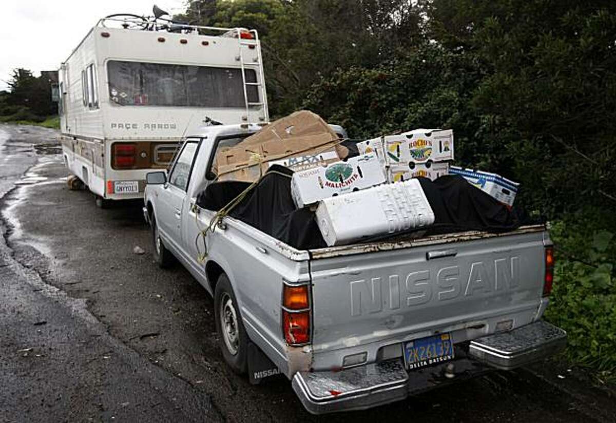 A pickup truck belonging to Bob Kaufman is filled with items and parked behind a motor home where Kaufman lives on Beatty Avenue just outside San Francisco city limits in Brisbane, Calif., on Friday, Jan. 22, 2010. Kaufman is caught in a legal battle over a number of vehicles he parks but never moves.