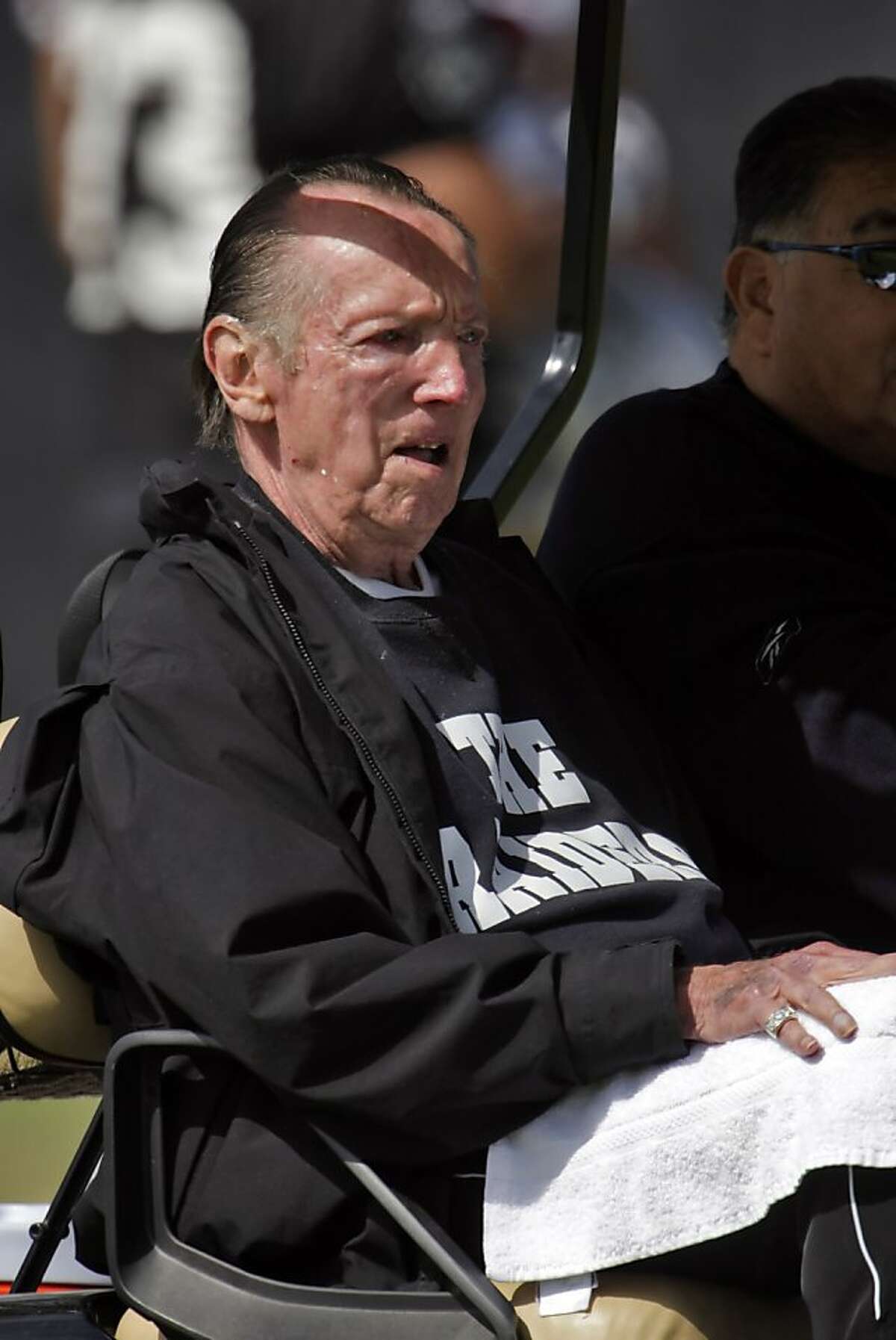 Raiders owner, Al Davis, leaves the field after practice at the Raiders training camp.