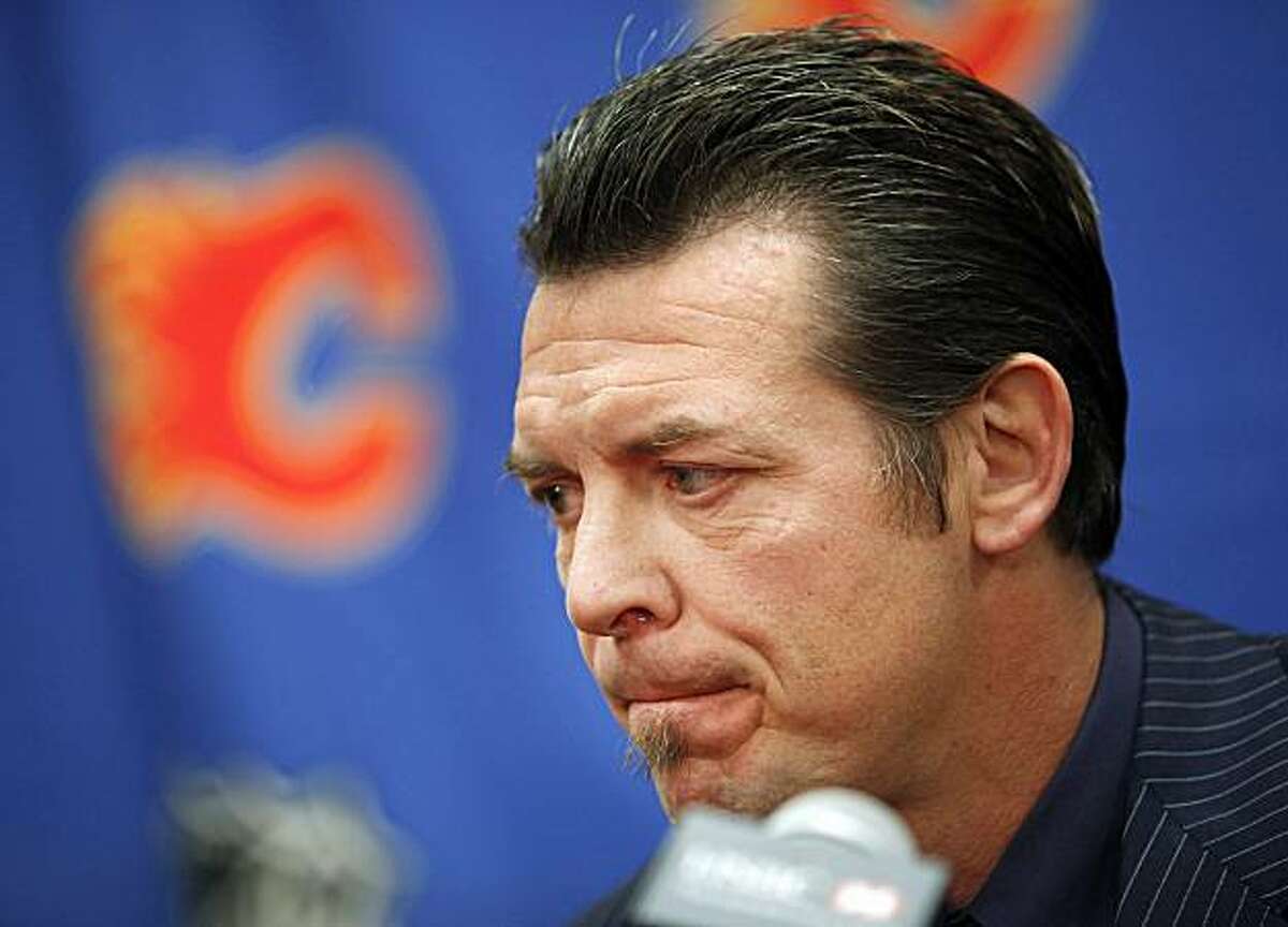 FILE -- This is a Sept. 28, 2009, file photo showing hockey player Theoren Fleury announcing his retirement in Calgary, Alberta. Former NHL star Theo Fleury says he was sexually abused by a junior hockey coach. Fleury's account is detailed in an autobiography called "Playing With Fire." The book is to be released next week. (AP Photo/The Canadian Press, Jeff McIntosh)
