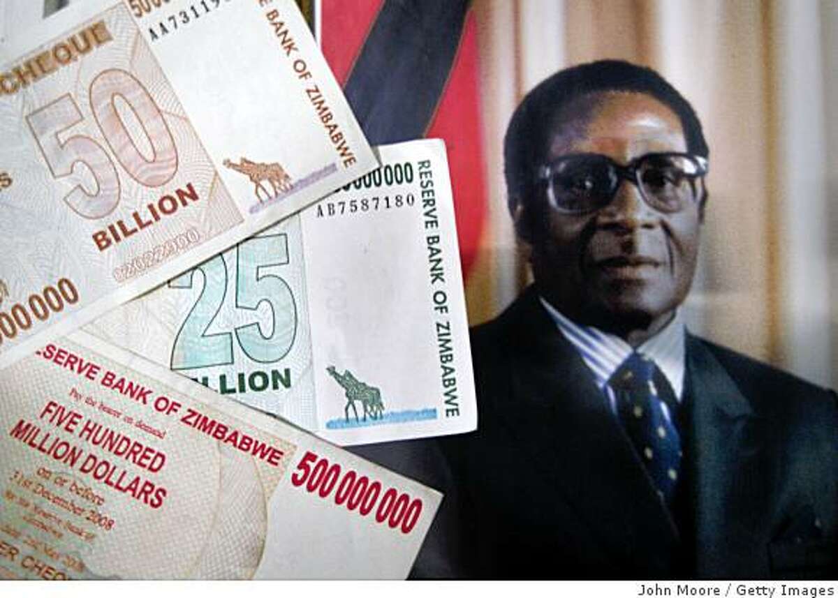BULAWAYO, ZIMBABWE - (FILE) The official portrait of President Robert Mugabe hangs on the wall as Zimbabwaen dollar bank notes are shown June 28, 2008 at the airport in Bulawayo, Zimbabwe. To combat Zimbabwe's hyper-inflated economy ten zeros have been removed from currency July 30, 2008 with ten billion dollars becoming one dollar. (Photo by John Moore/Getty Images)