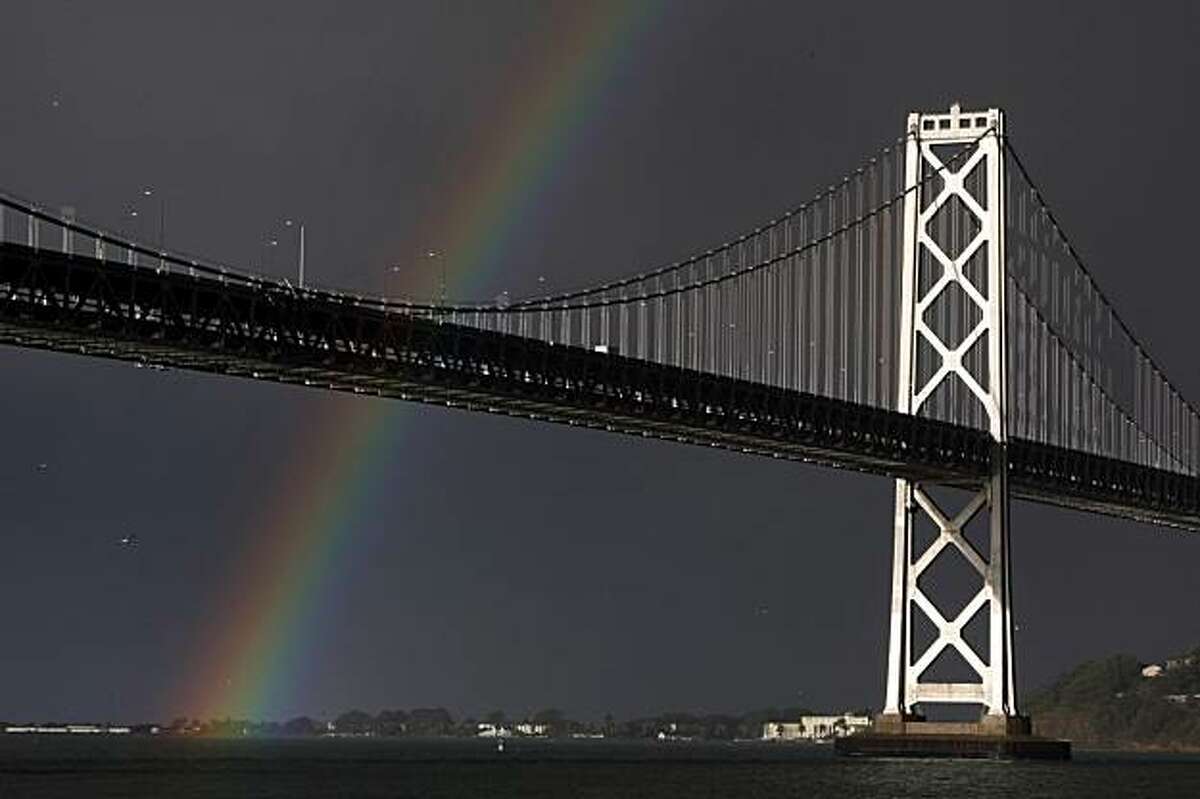 The San Francisco Bay Area was bombarded by storms Tuesday but during a brief respite, was graced by a rainbow that touched down at Treasure Island.