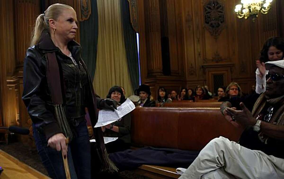 Kimberley Celoni , a patient at the Trauma Recovery Center, is applauded after testifying in front of the Board of Supervisors asking to keep the centers doors open, Wednesday Jan. 20, 2010, in San Francisco, Calif.
