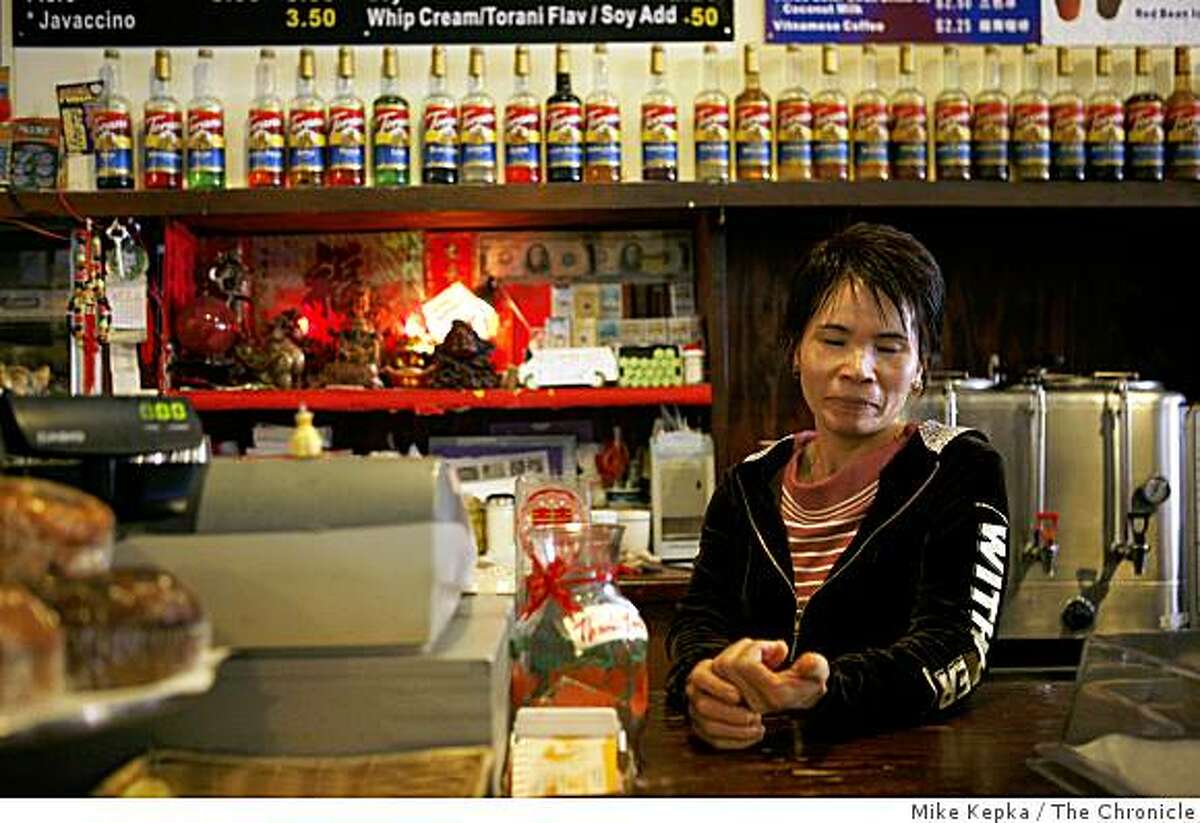 Chu Mei Yang, of San Francisco, poses for a portrait in her Clement Street coffee shop called Java Source on July 24, 2008 in San Francisco, Calif. Yang, who works nearly 12 hours a 7 days a week, says she is so busy with work she doesn't think she even be able to watch any of the Olympics. Photo by Mike Kepka / The Chronicle