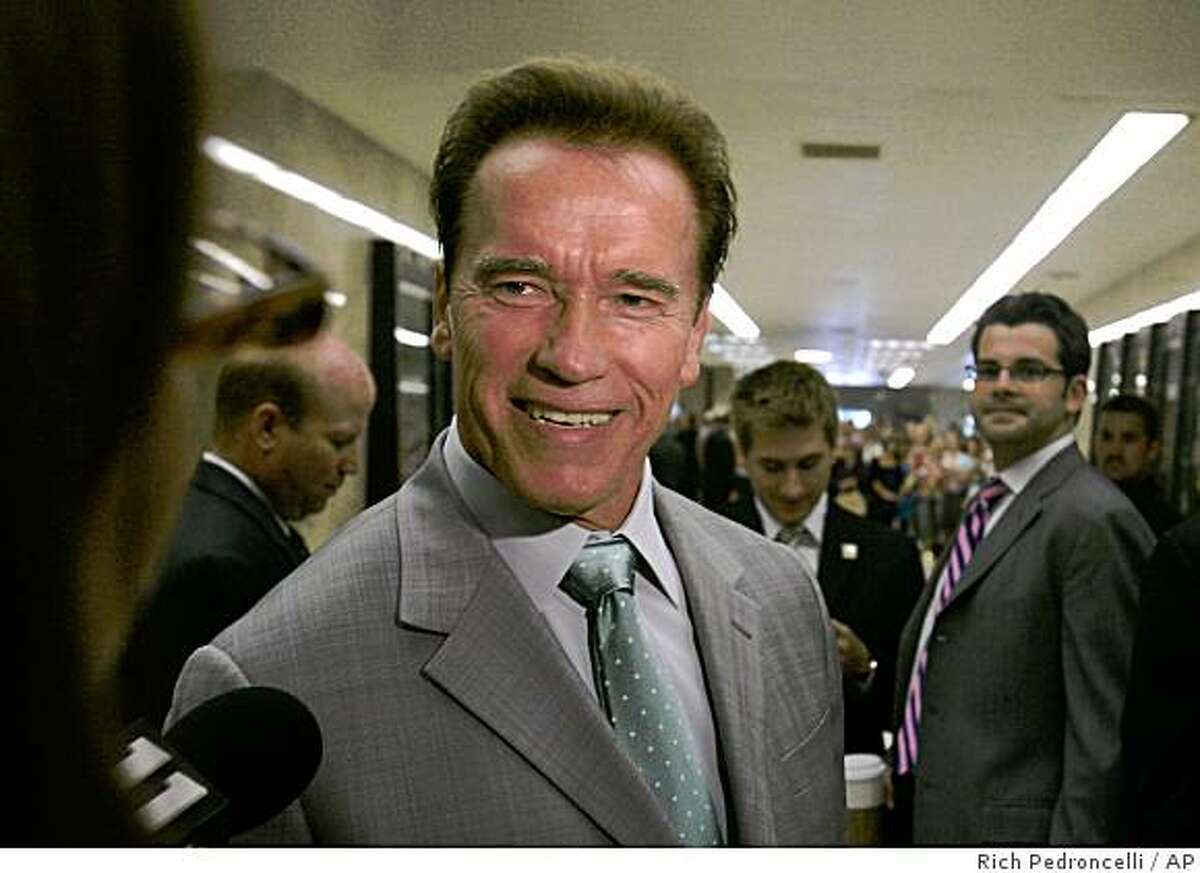 Gov. Arnold Schwarzenegger smiles as he takes a reporter's question following a Capitol news conference in Sacramento, Calif., Wednesday, July 16, 2008.(AP Photo/Rich Pedroncelli)