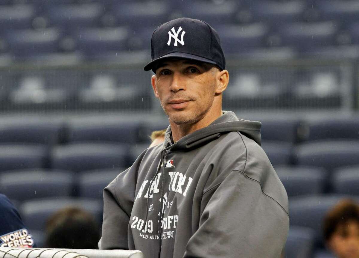 New York Yankees manager Joe Girardi looks around Yankee Stadium during a practice session for the Major League Baseball World Series Tuesday, Oct. 27, 2009, in New York. The Yankees play the Philadelphia Phillies in Game 1 of the World Series on Wednesday, Oct. 28, 2007. (AP Photo/Eric Gay)