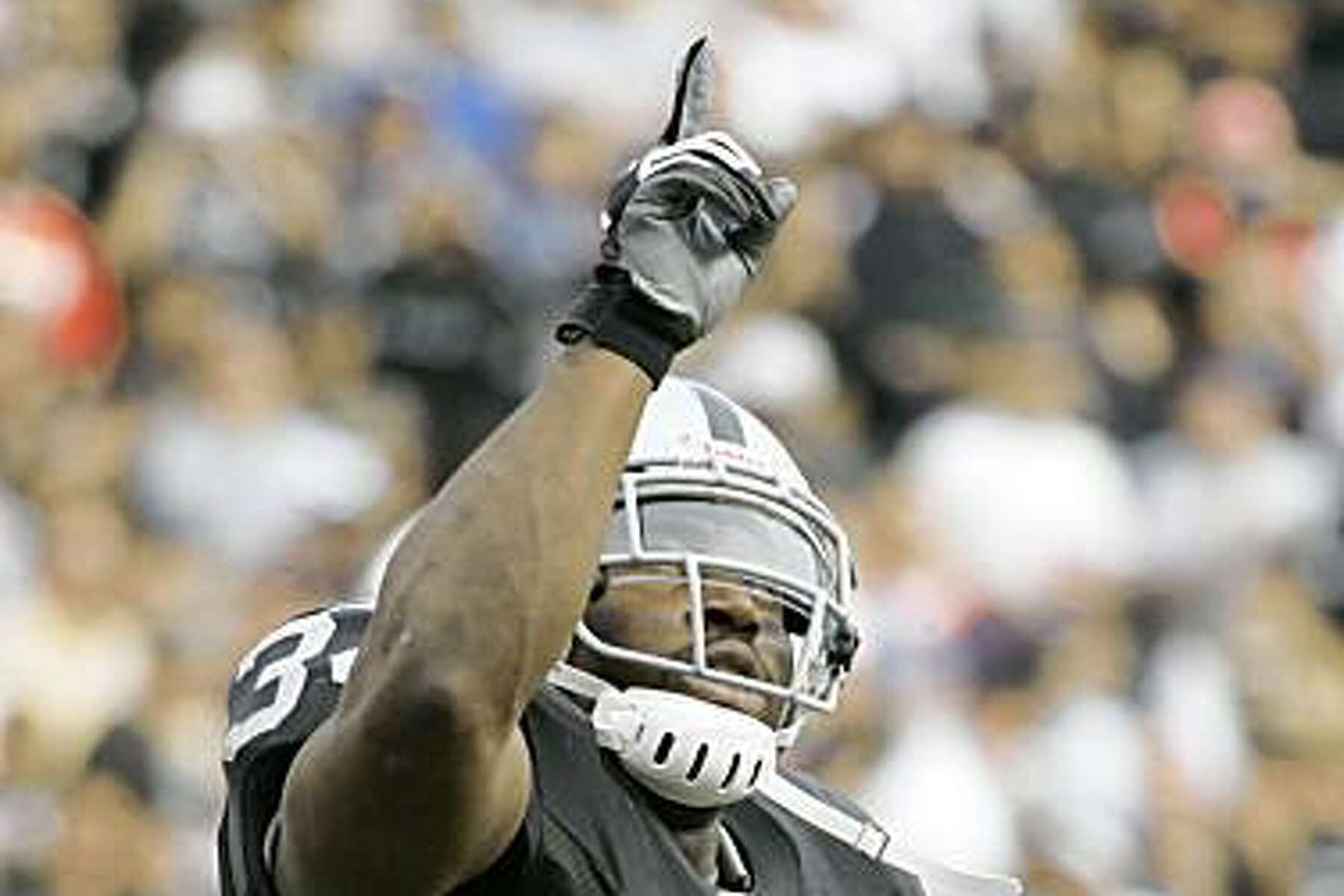 LaMont Jordan of the Oakland Raiders looks on before the game