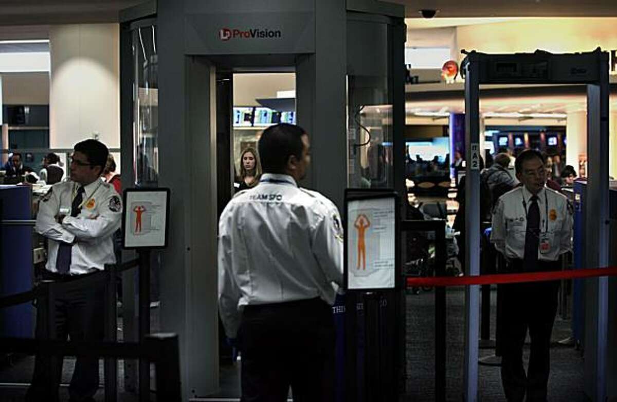 Security at SFO International Airport using the Whole Body Imager (WBI) in South San Francisco, Ca., on Monday, December 28, 2009. Using millimeter wave detection the WBI (middle) is the only scanner in the bay area which SFO has been using since nine months ago.