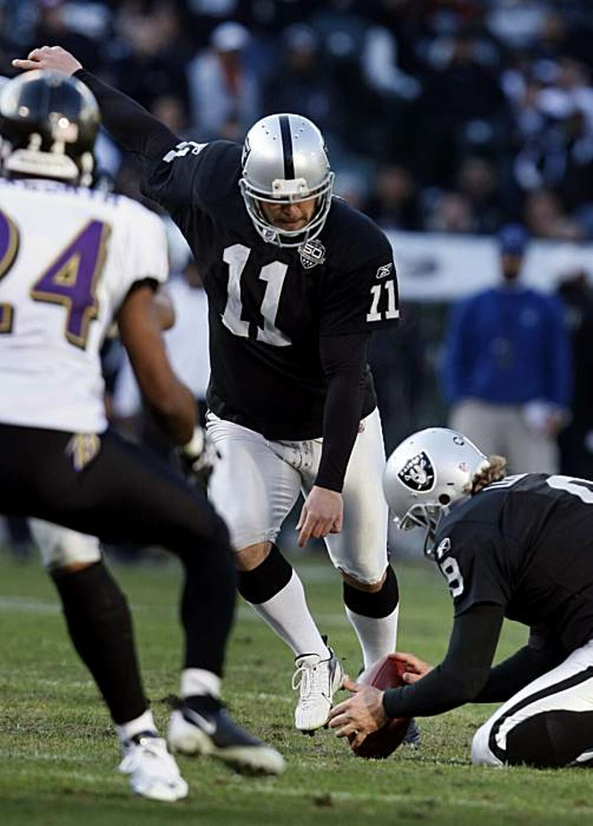 Oakland Raiders kicker Sebastian Janikowski kicks a field goaled against the Baltimore Ravens, Sunday Jan.3, 2010, in Oakland, Calif. This was the 1000 point record that Janikowski hit while playing for the Raiders.