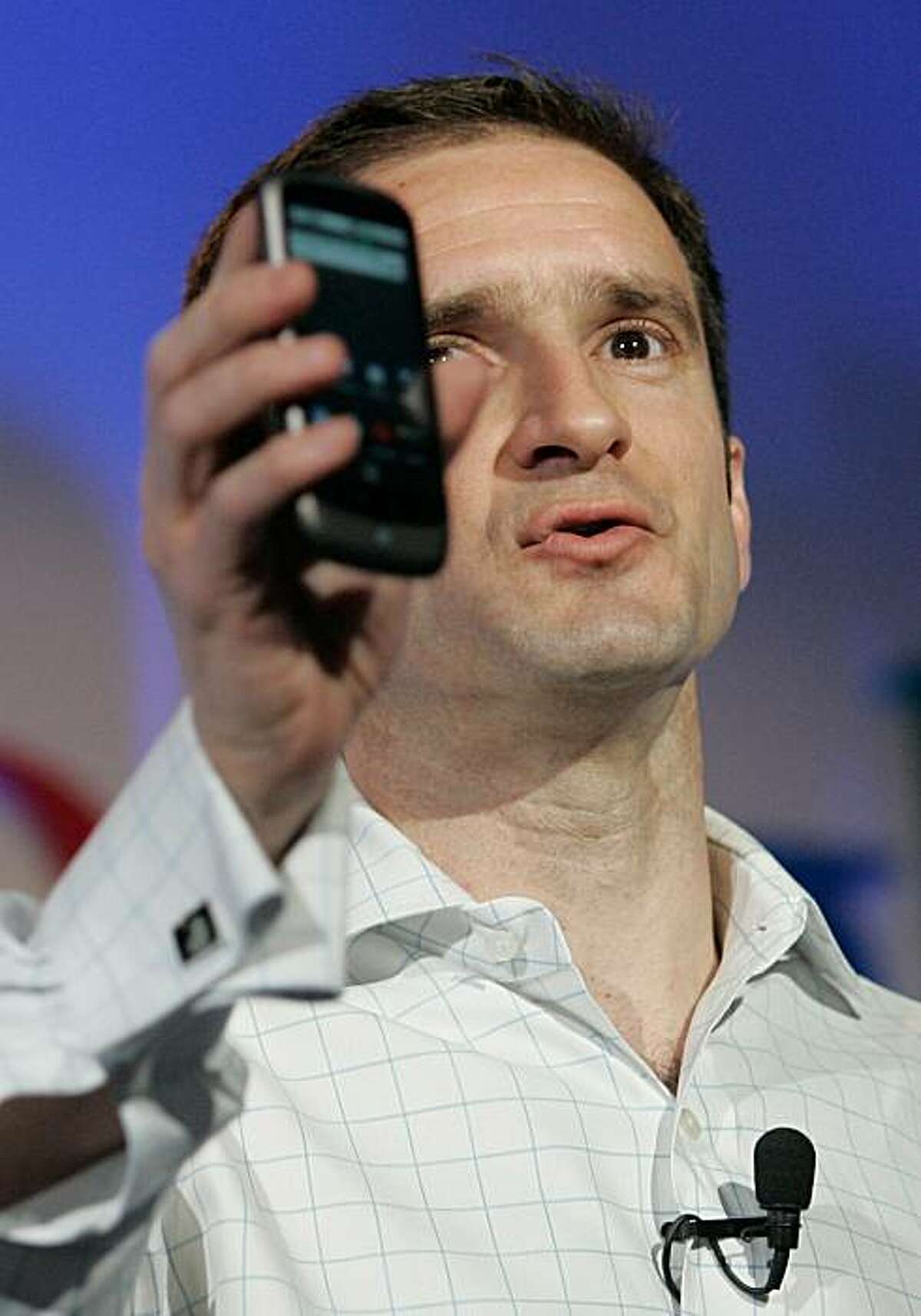 Mario Queiroz, Vice President of Product Management for Google, holds up the Nexus One smartphone running on the Google Android platform, the first mobile phone the internet company will sell directly to consumers, during a news conference at Google headquarters in Mountain View, California January 5, 2010. POOL/Robert Galbraith (Photo credit should read ROBERT GALBRAITH/AFP/Getty Images)