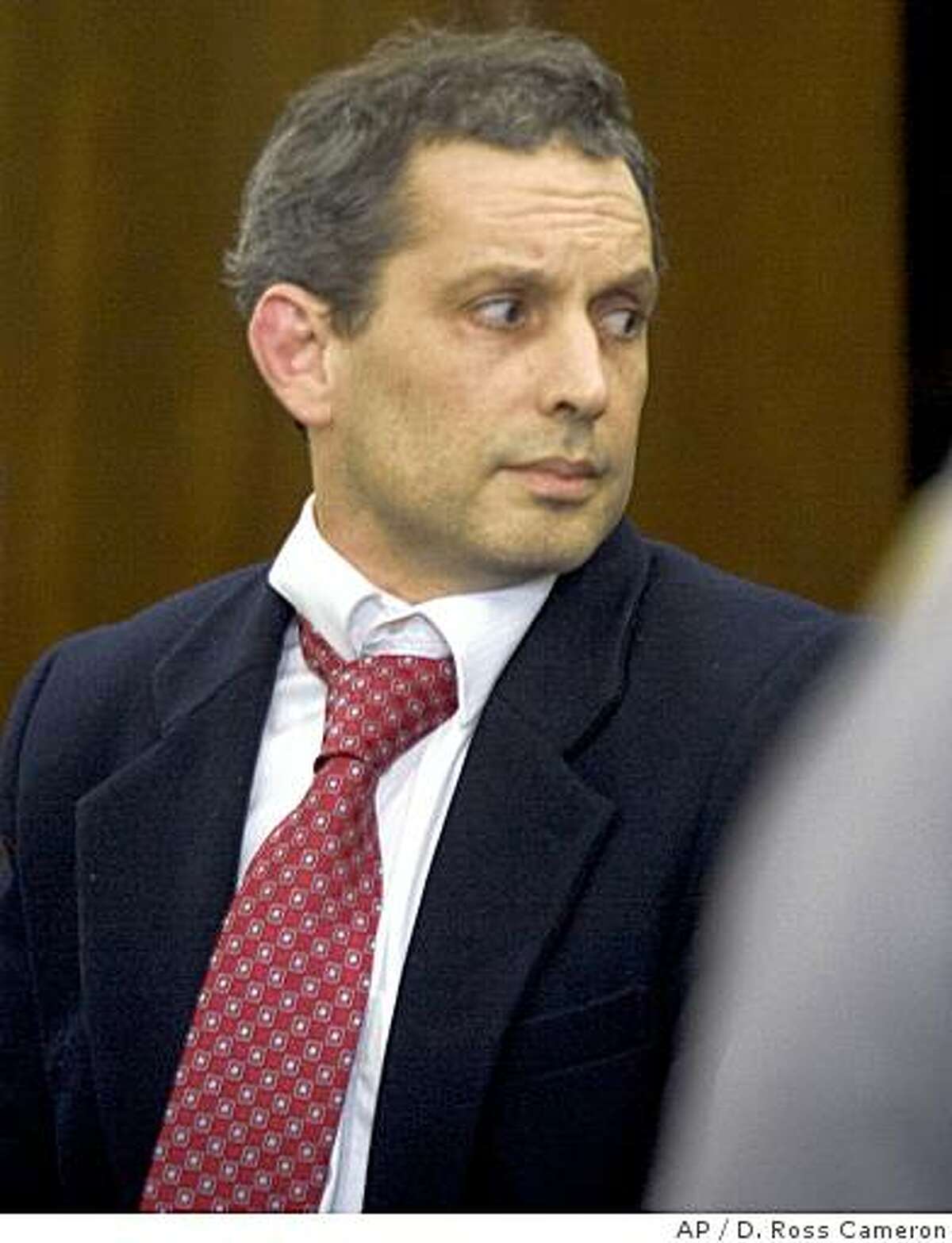 ** FILE ** In this Monday, April 28, 2008 file picture, Hans Reiser is escorted from the courtroom following the reading of the verdict in his murder trial in Oakland, Calif. The California software programmer convicted of killing his estranged wife, Nina Riser, has led police to a corpse that is believed to be hers. An attorney for Hans Reiser said his client led police to a wooded area of Redwood Regional Park in the Oakland hills. (AP Photo/D. Ross Cameron, Pool)
