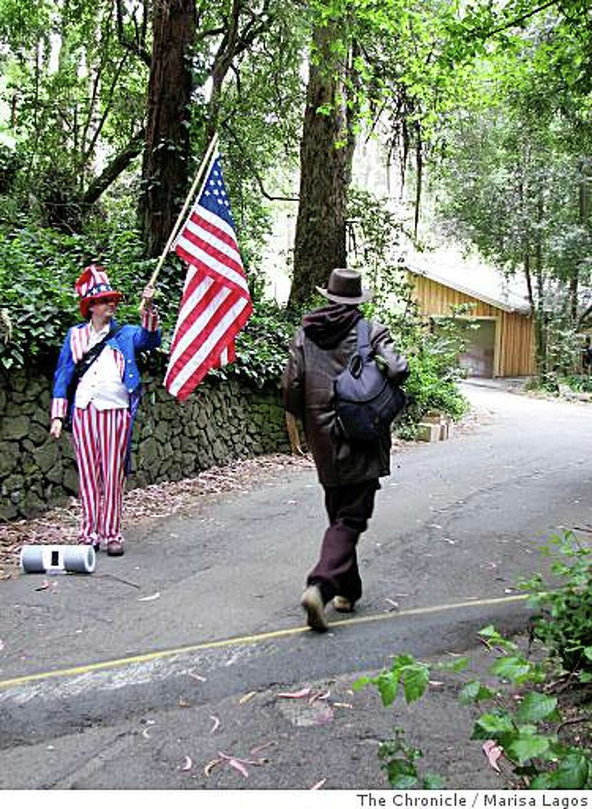 T. Wayne Pickering (Brian McConnell, left) stands at Stern Grove dressed as uncle Sam and blaring patriotic music from his boom box, trying to get more signatures for a ballot petition to rename the Oceanside Water Pollution Control Plant the George W. Bush Treatment Plant on Monday, June, 23, 2008, in San Francisco, Calif.
