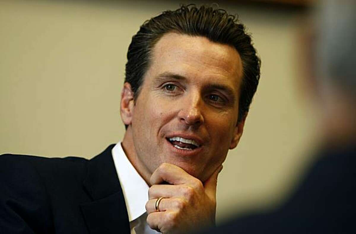 Gubernatorial hopeful San Francisco Mayor Gavin Newsom talks with some of the senior staff members of San Quentin Prison who explains some of their unique problems trying to run an old prison. Friday June 19, 2009
