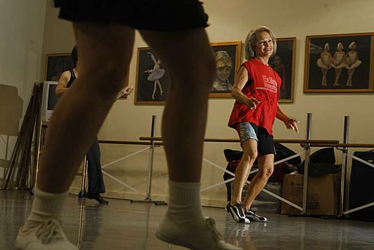 Willow Carter (right) wears her customary Pumas and cut off muscle shirt while working out in her Boomercize class taught by Instructor Marcie Judelson (foreground feet) at the Presidio Dance Theatre in San Francisco, Calif. on Monday December 14, 2009.