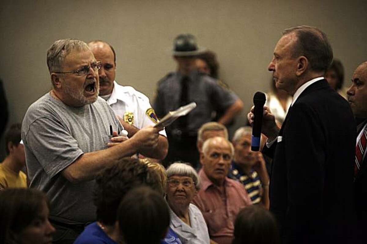 **FILE PHOTO** Sen. Arlen Specter (D-Pa.) faces a hostile audience at a town hall meeting in Lebanon, Pa., on Aug. 12, 2009. (Damon Winter/The New York Times)