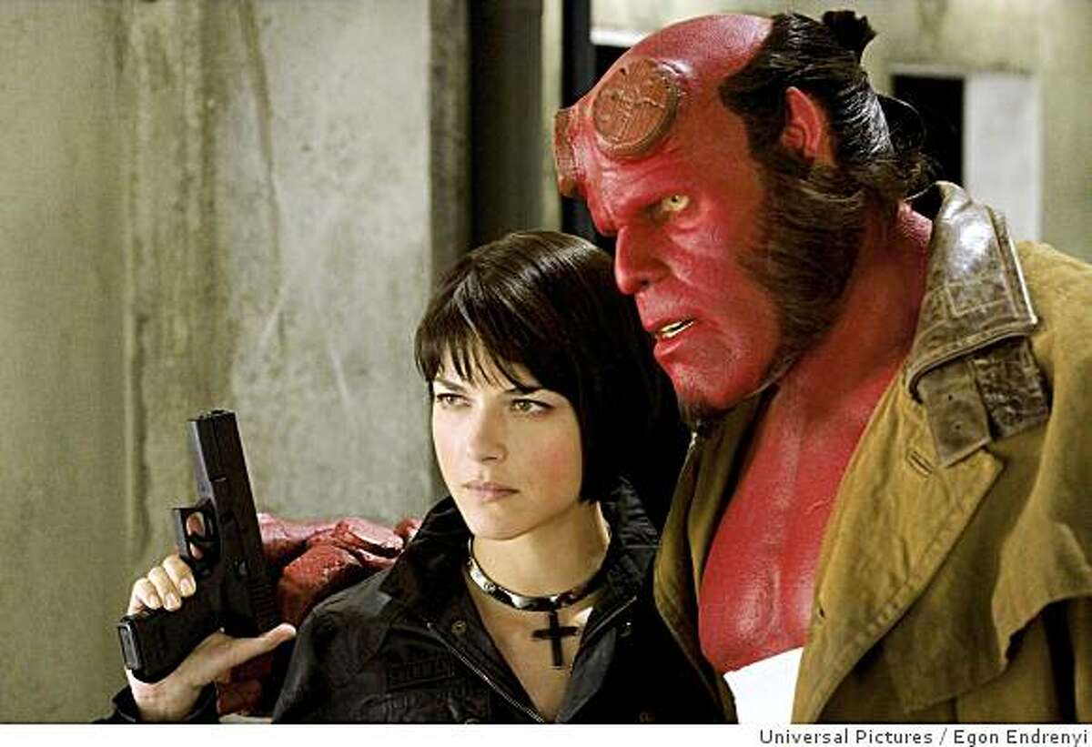 In this image released by Universal Pictures, Selma Blair, left, and Ron Perlman are shown in a scene from, "Hellboy II: The Golden Army." (AP Photo/Universal Pictures, Egon Endrenyi) ** NO SALES **