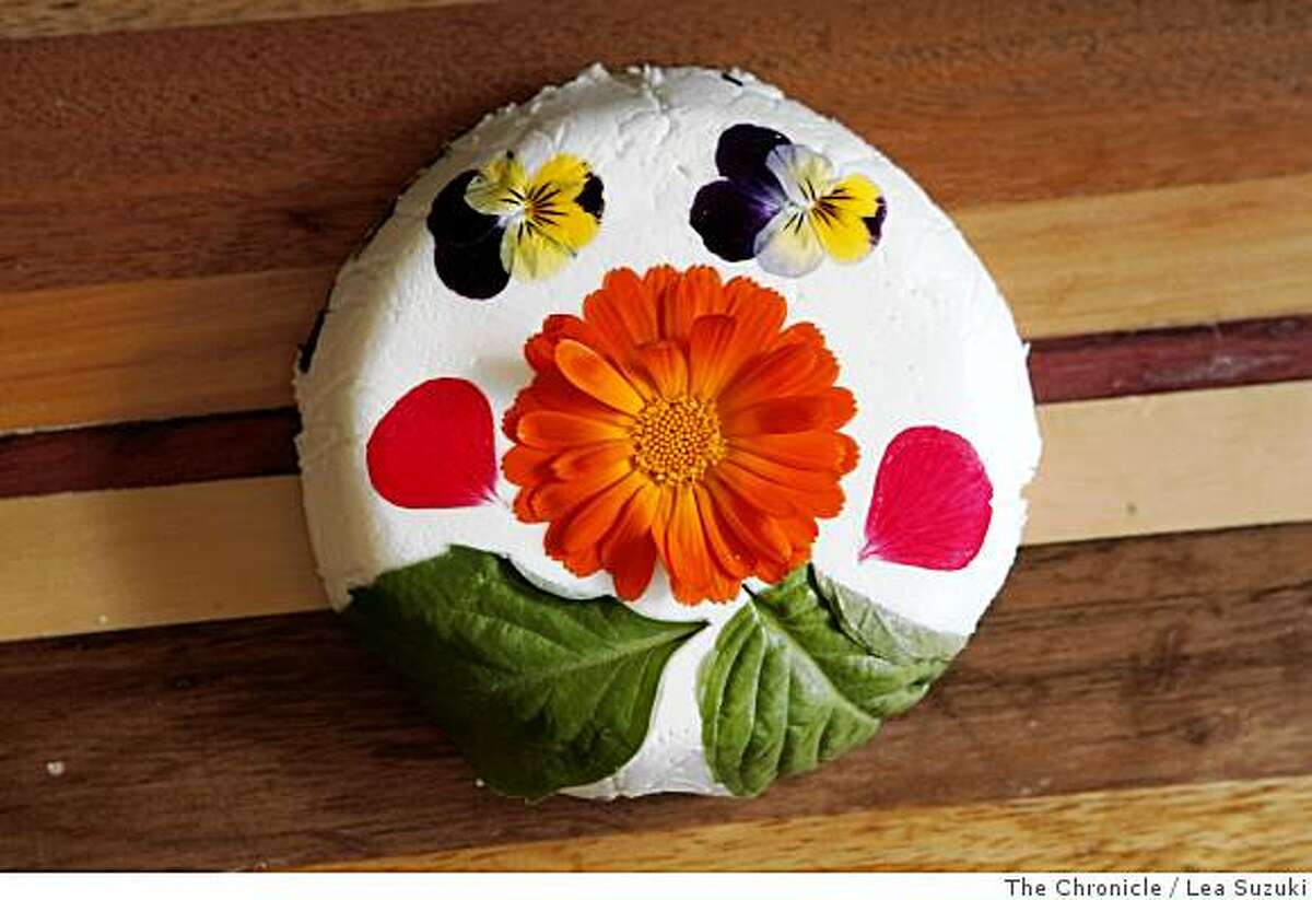 A cheese round decorated with flower petals at Harley Farms on Wednesday June 4, 2008 photographed at Harley Farms. Terri Reece helped Dee Harley when she upgraded her computers, made a conference room wireless and with other ways to become a more green with her computers.Photo By Lea Suzuki/ The Chronicle