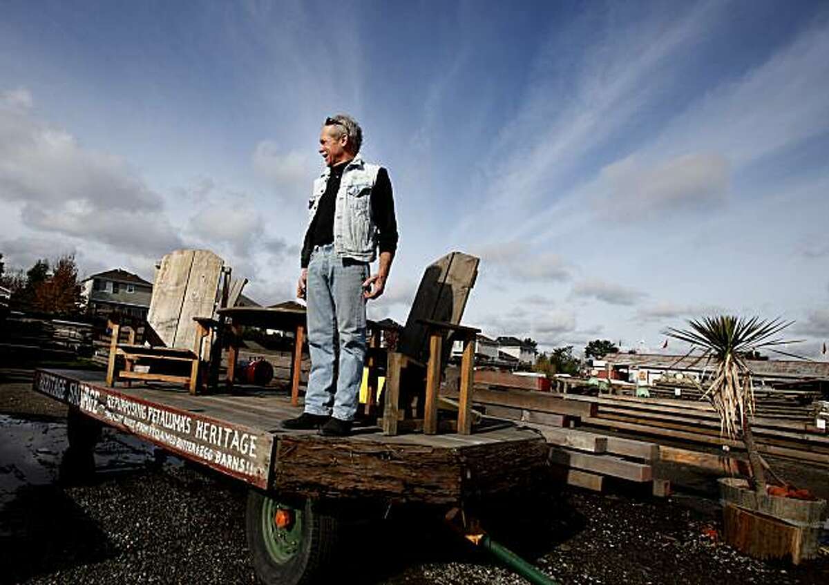 "Bug" Deakin in the middle of his used paradise. Heritage Salvage in Petaluma, CA boasts three acres of recycled woods and building materials. It is owned by Michael "Bug" Deakin who also sells finished furniture made from recycled materials.