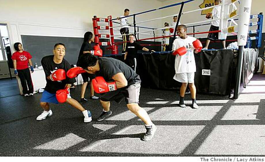 Young teens practice boxing, Wednesday July 2, 2008, at the YMCA in San S.F. police start youth boxing program - SFGate