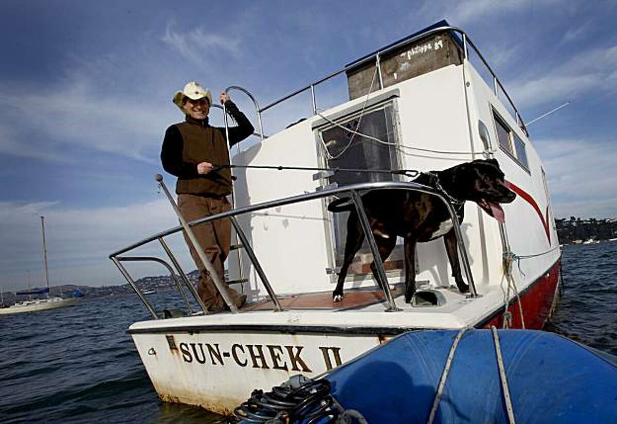 Weissleder and Pico prepare to go back to the mainland. Myles Weissleder uses a floating office, a houseboat anchored off Sausalito, for his technology business. He regularly commutes to the houseboat from a tender with his trusty dog Pico.