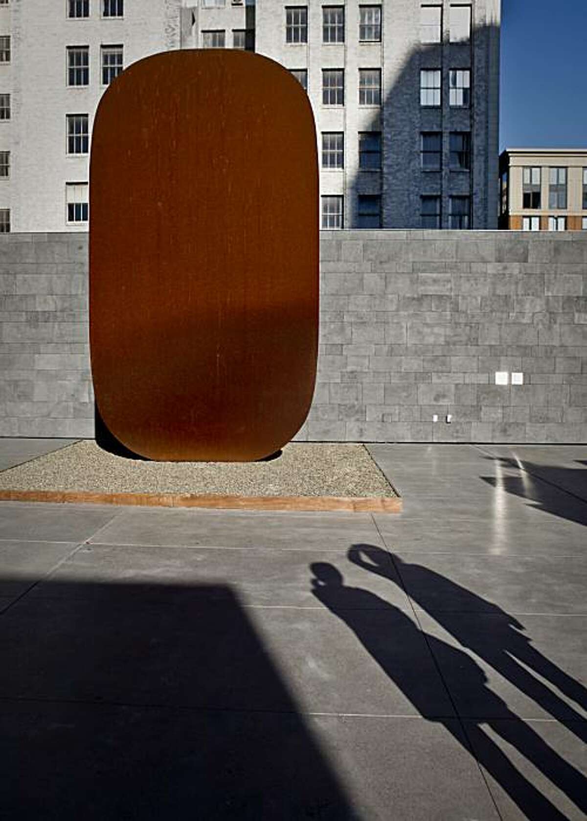 Andrea Silvestri of Oakland, left, and Edi Berton of San Francisco look at Ellsworth Kelly's Stele I in The Rooftop Garden at the San Francisco Museum of Modern Art on Thursday, Dec. 3, 2009.