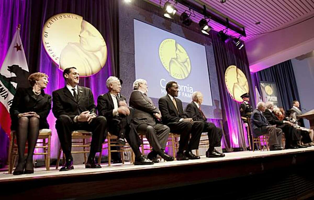 California Hall of Fame inductees laugh at a joke by the governor during the ceremony at the California Museum on Tuesday. At left are Carol Burnett and Stuart Milk, Harvey Milk's nephew.