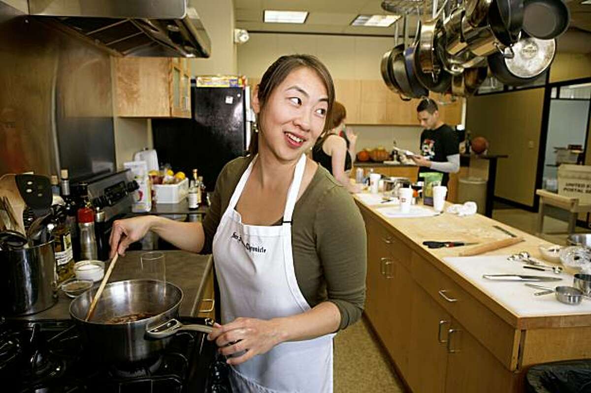 Janny Hu stirs the pie filling in the Chronicle test kitchen on Thursday, Nov. 5, 2009 in San Francisco, Calif.