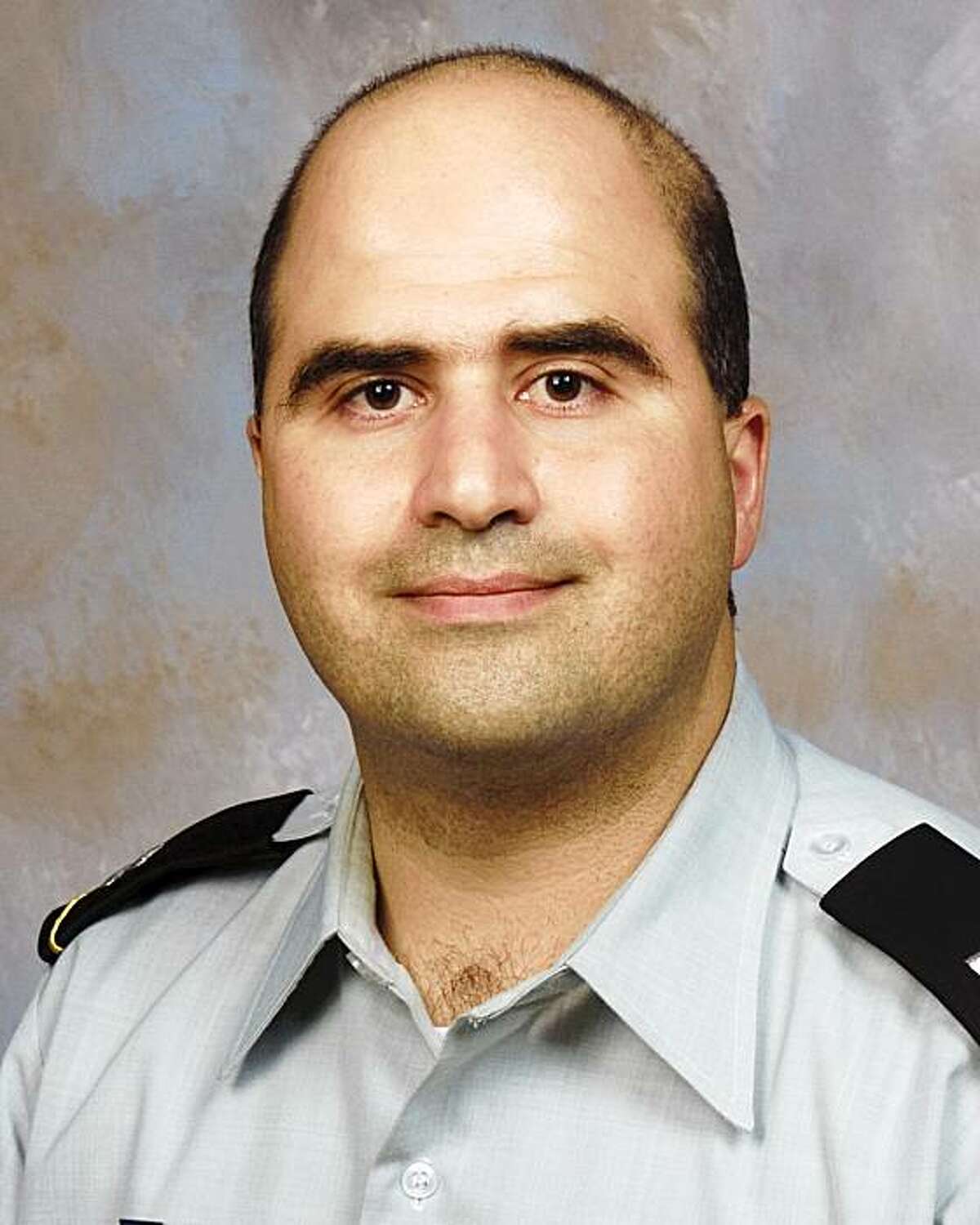 The 2007 picture provided by the Uniformed Services University of the Health Sciences shows Nidal Malik Hasan when he entered the program for his Disaster and Military Psychiatry Fellowship. Authorities said he went on the killing spree at Fort Hood, Texas which left 13 people dead. (AP Photo/Uniformed Services University of the Health Sciences)