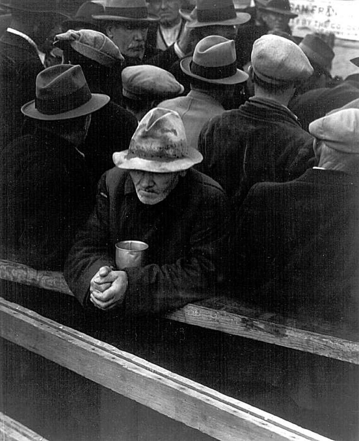 A man waits in a breadline in San Francisco in 1933, the year unemployment hit 24.9 percent.