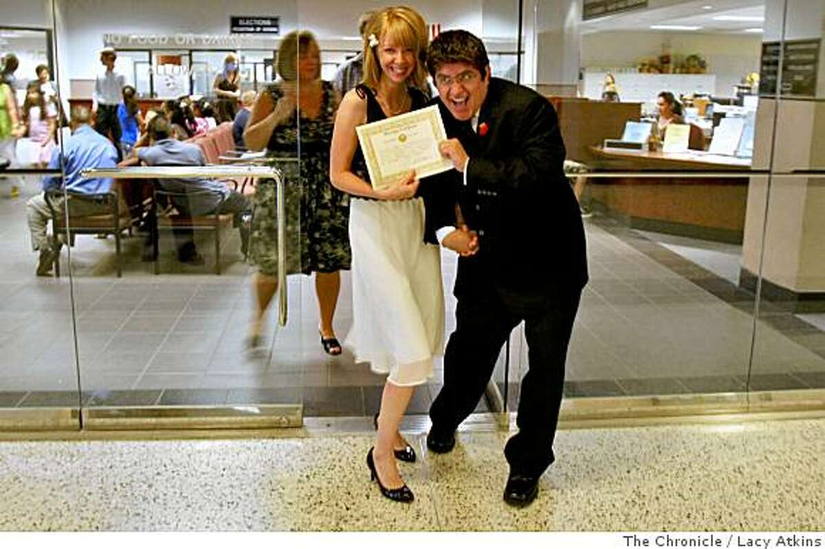 Amanda Camerer and Jorge Muica show off their marriage certificate as they leave the Kern County Clerks office. Photo by Lacy Atkins / The Chronicle