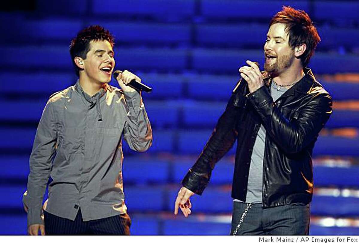David Cook, right, and David Archuleta perform during the season finale of American Idol on Wednesday May 21, 2008, in Los Angeles.